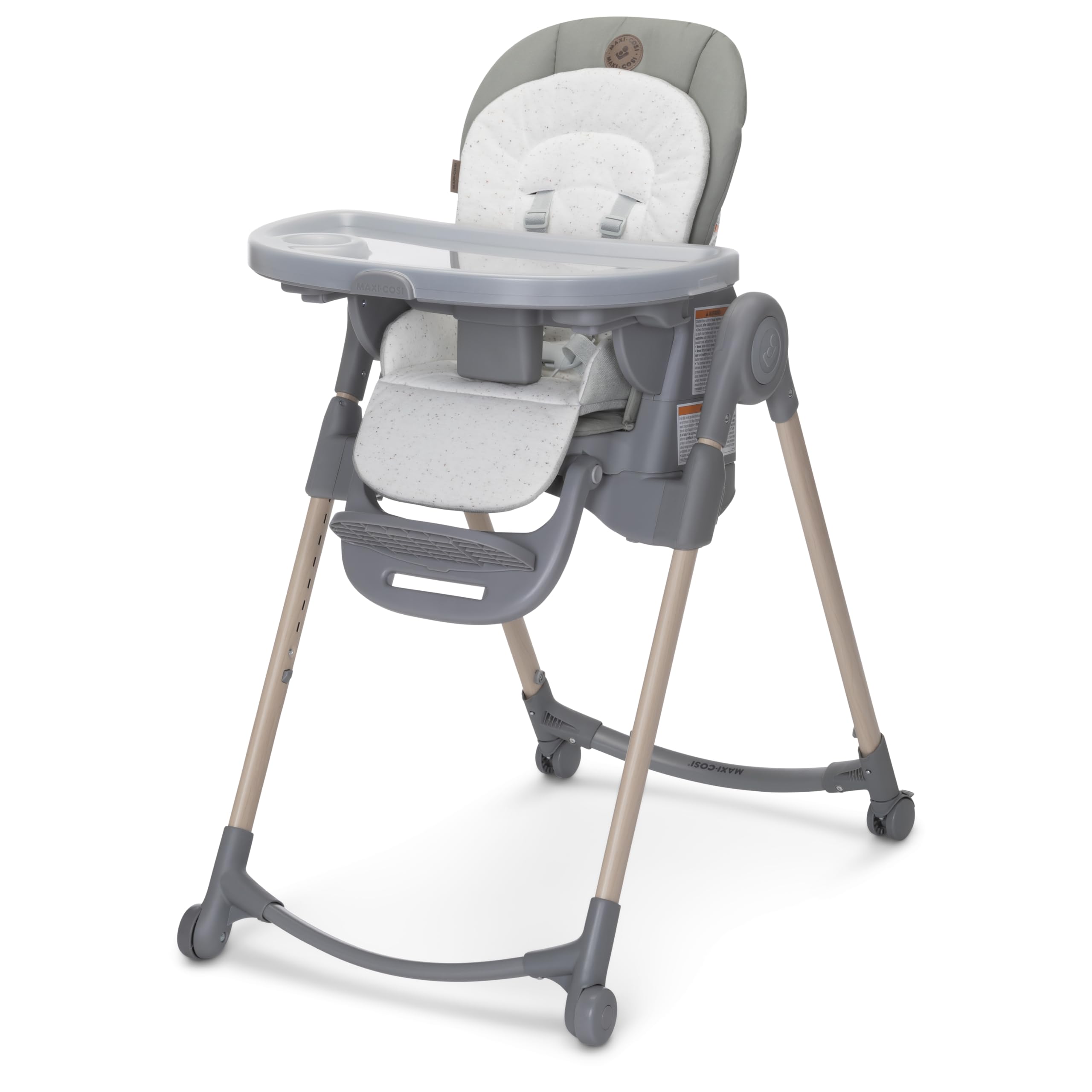 Maxi-Cosi Minla folded high chair green shows space-saving portability ideal for small kitchens.