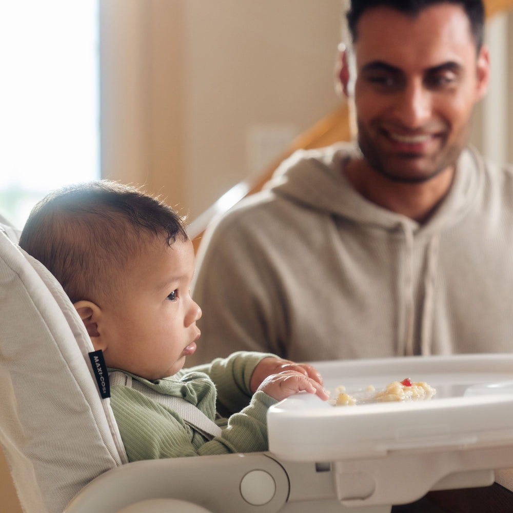 Maxi-Cosi Minla infant-high-chair-use demonstrates secure infant seating at mealtimes.