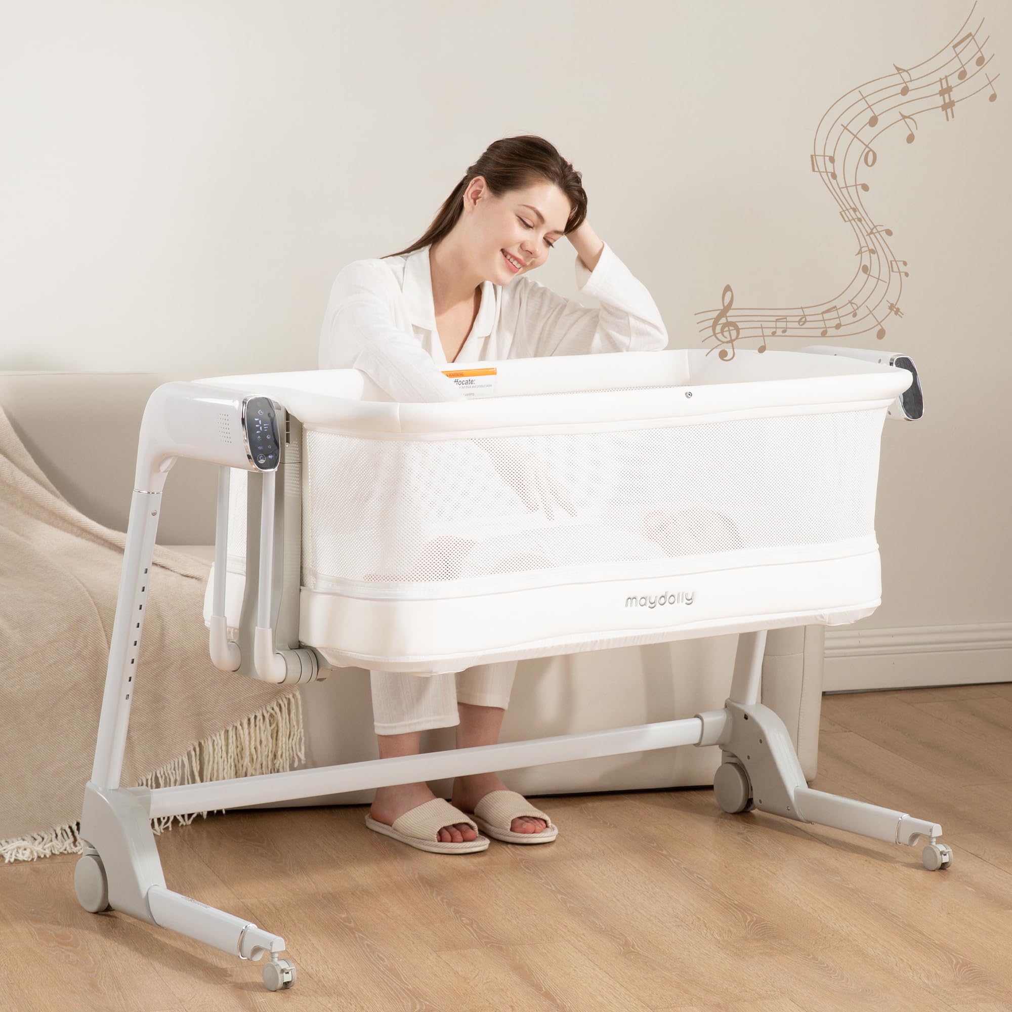 Maydolly baby bassinet showing automatic cry-detection feature for soothing