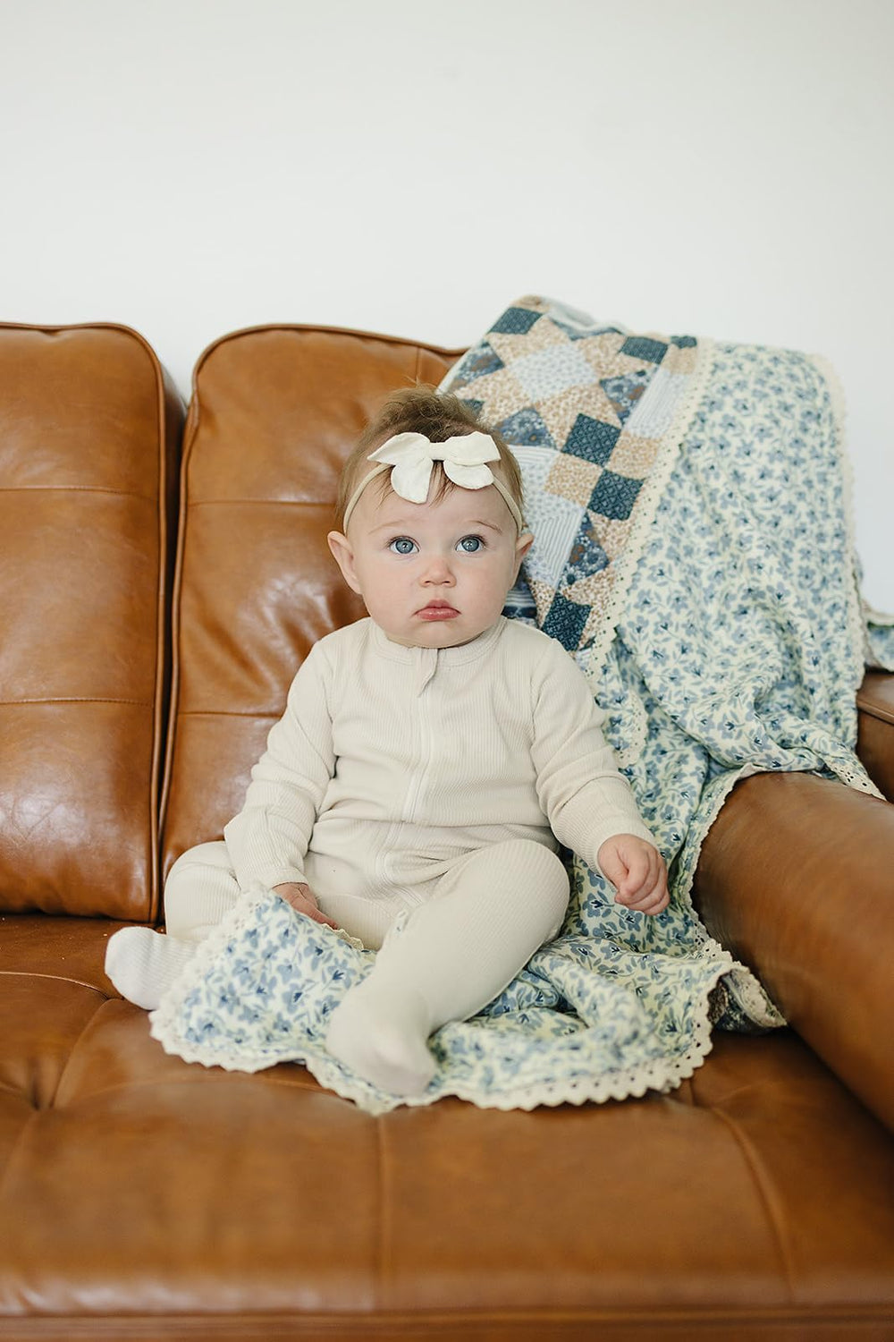 Mebie Baby blue blossom pattern close-up highlighting stitching and soft muslin finish.