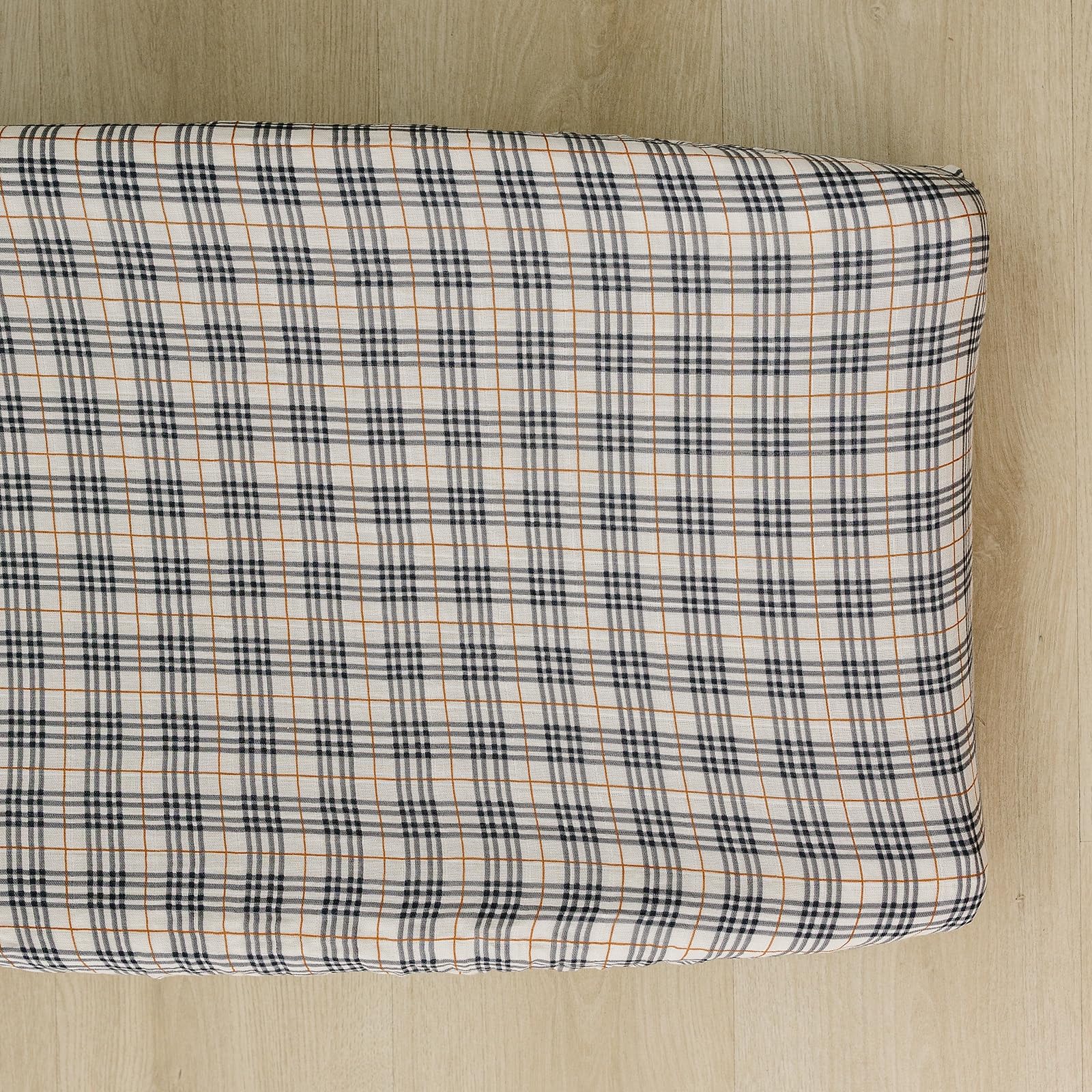Mebie Baby changing pad cover in vintage plaid closeup shows soft muslin texture for baby skin.