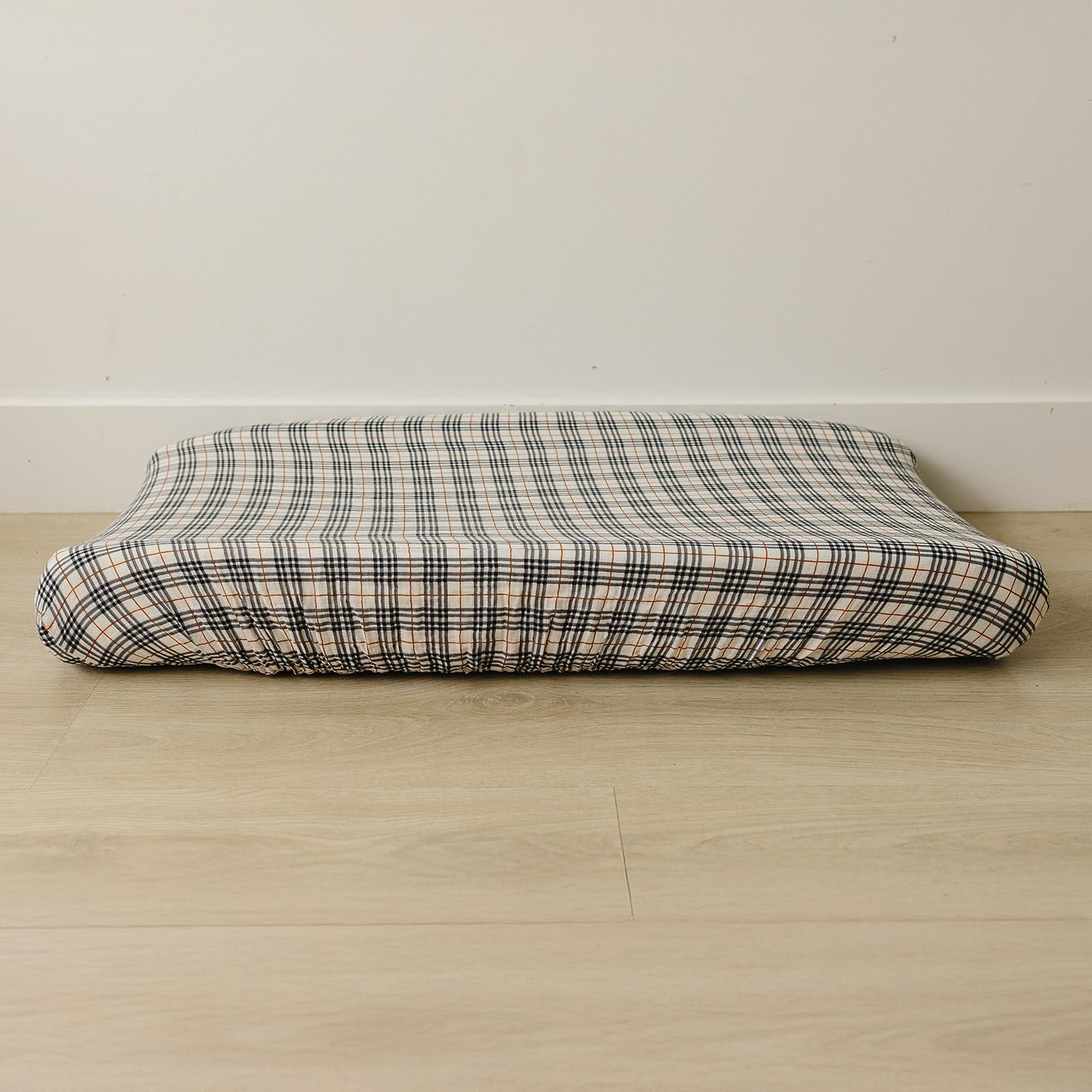 Mebie Baby vintage plaid changing pad cover on a standard pad demonstrates a stylish nursery fit.
