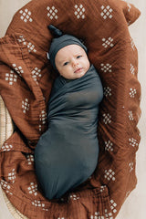 Mebie Baby Charcoal Stretch Swaddle wrapped snugly for newborn comfort.