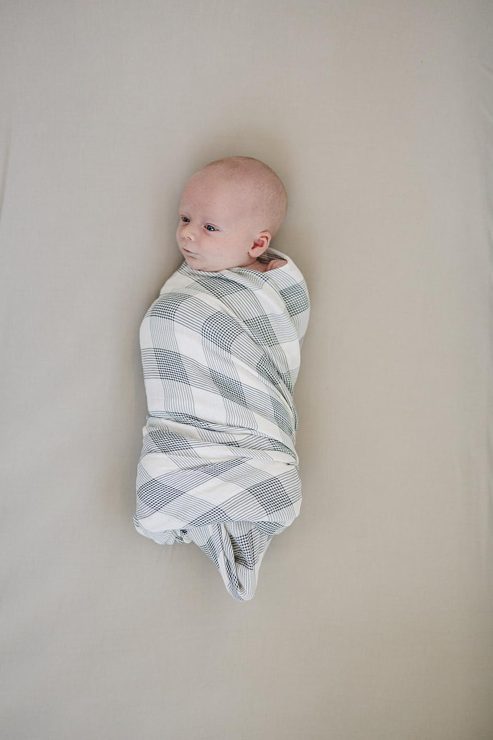 Mebie Baby Coastal Plaid Swaddle nursery setting, versatile lightweight blanket for on-the-go use