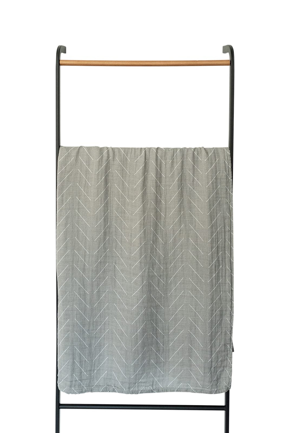 Mebie Baby swaddle in nursery setting highlights gender-neutral design for versatile decor.