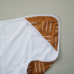 Mebie Baby hooded towel on a tiny baby provides gentle drying and snug comfort.