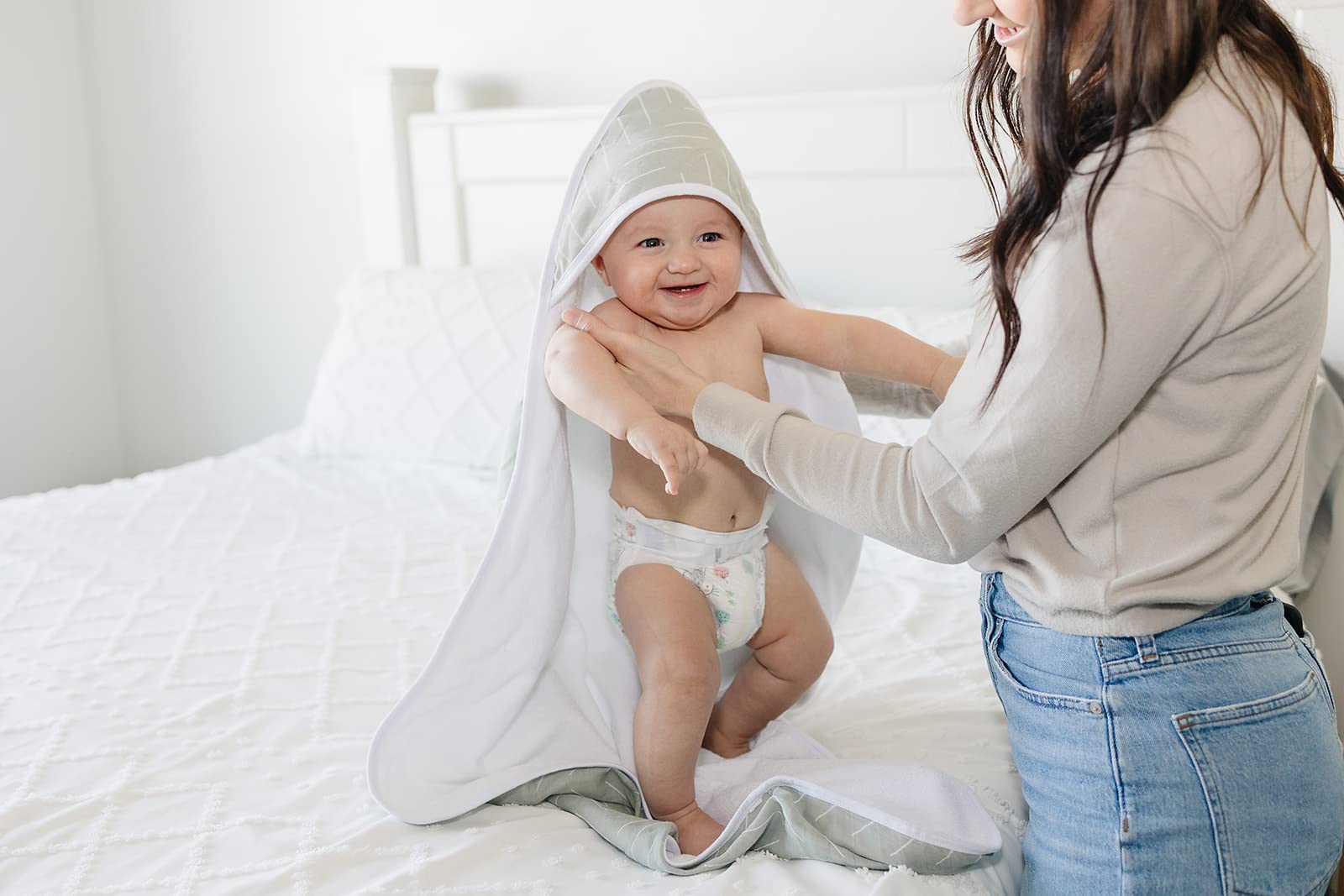 Mebie Baby hooded-towel folded on changing table shows compact storage
