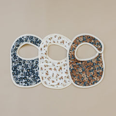 Close-up of Mebie Baby muslin bib in vintage floral showing breathable fabric