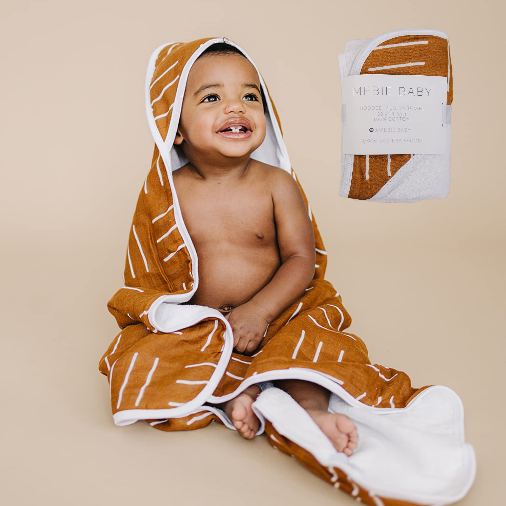 Mebie Baby muslin hooded towel mustard mudcloth offers cozy warmth after bath time.