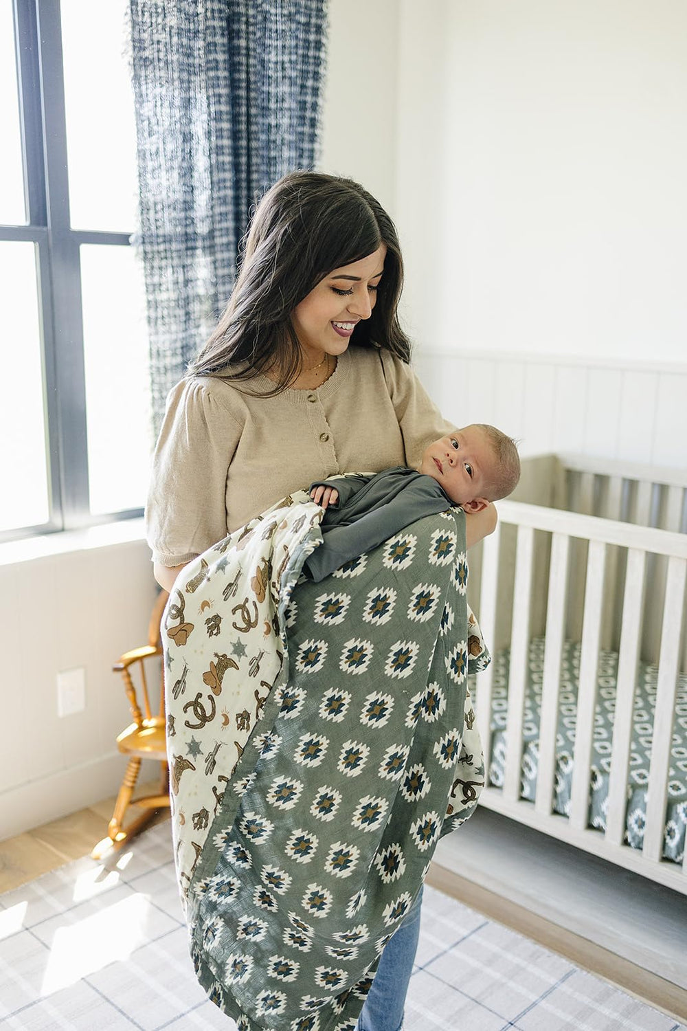 Mebie Baby muslin quilt displayed in a gender-neutral nursery setup.