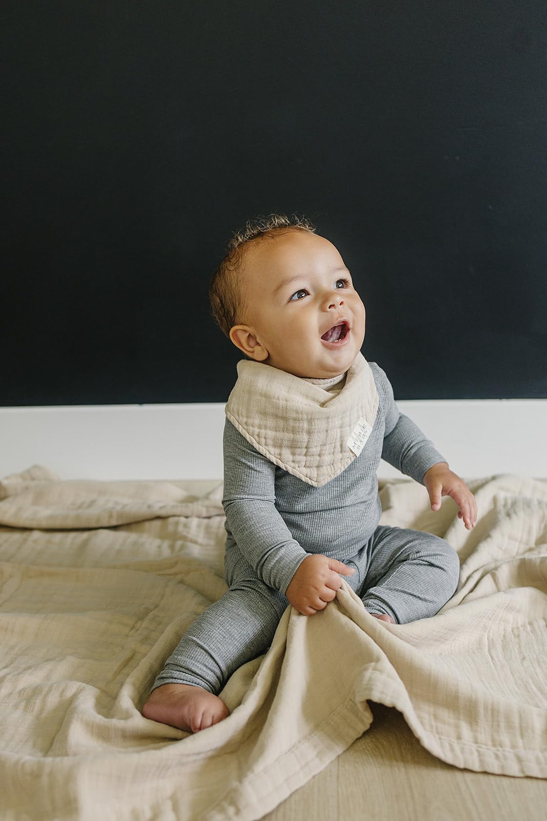 Mebie Baby muslin quilt oatmeal in nursery shows simple gender-neutral design for any room