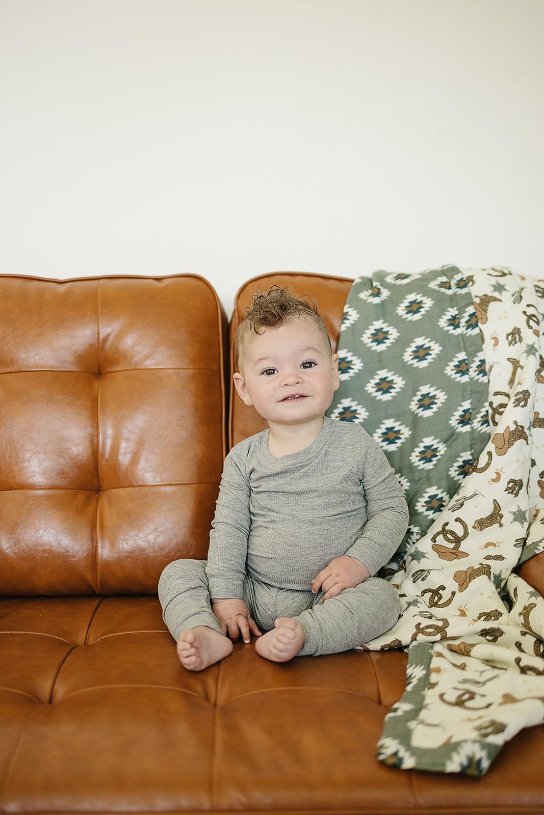 Mebie Baby muslin quilt with Outlaw Cowboy design ideal for stroller rides.
