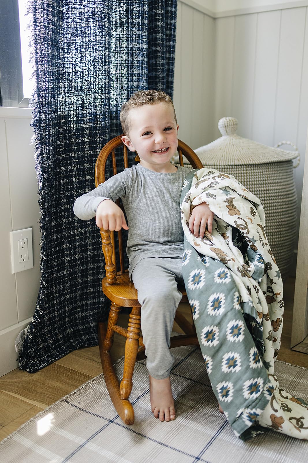 Mebie Baby muslin quilt close-up showing four-layer fabric for durability.