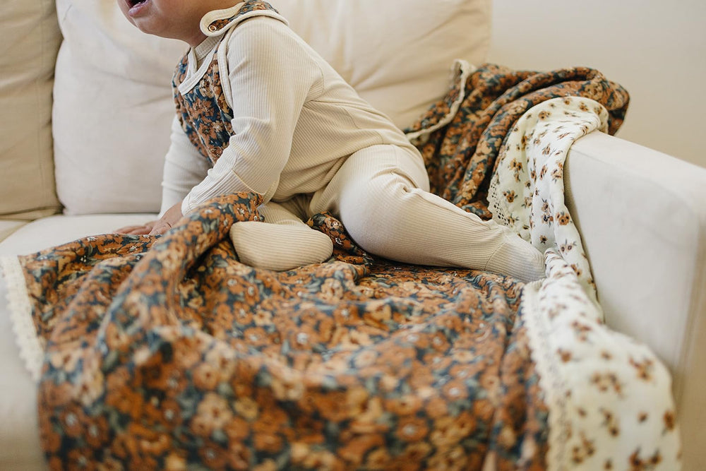 Mebie Baby quilt in a modern nursery, complements neutral decor and cozy vibes.