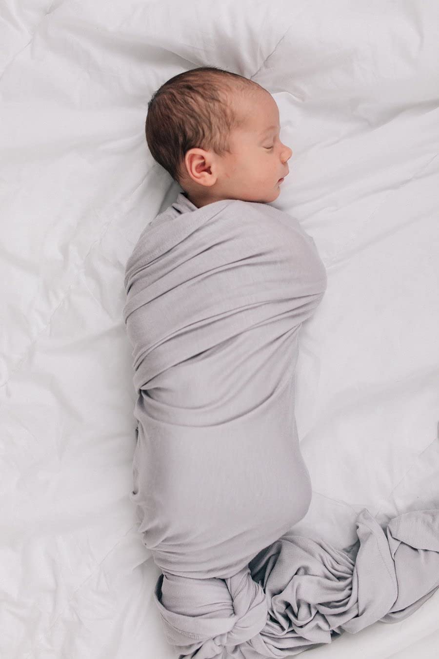 Mebie Baby Stone Swaddle baby-wrapped view demonstrates secure wrap and cozy cuddles.