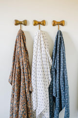 Mebie Baby Venetian Floral Swaddle flat lay showing modern design and nursery-ready look.