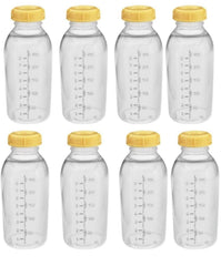 Medela bottle lids close-up, leak-proof design for travel and fridge storage.