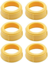 Medela collar rings shown with plastic and glass bottles for leak-free feeding setup.