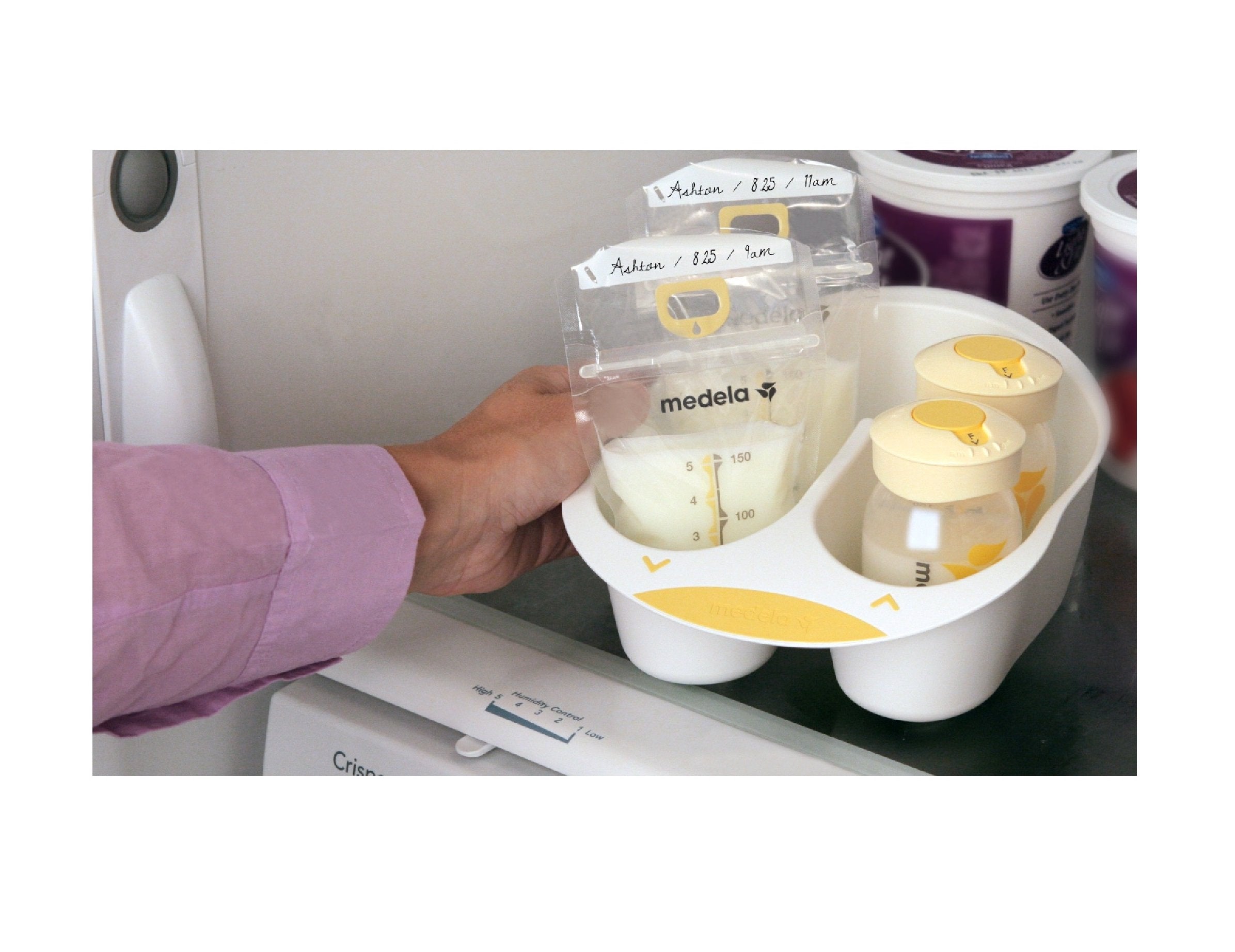 Medela storage tray keeping bottles organized in fridge or freezer