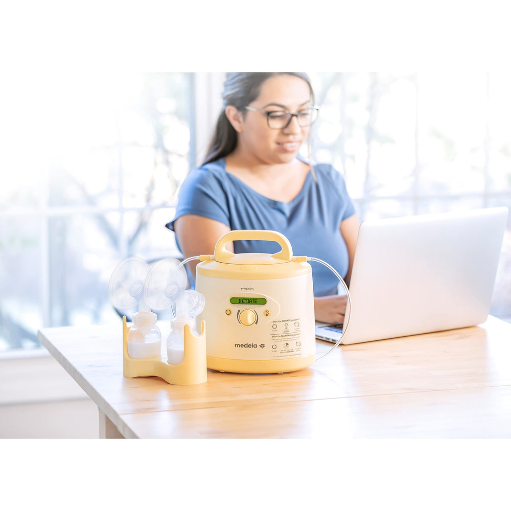 Medela Symphony Plus cord protector guarding cables during pumping.