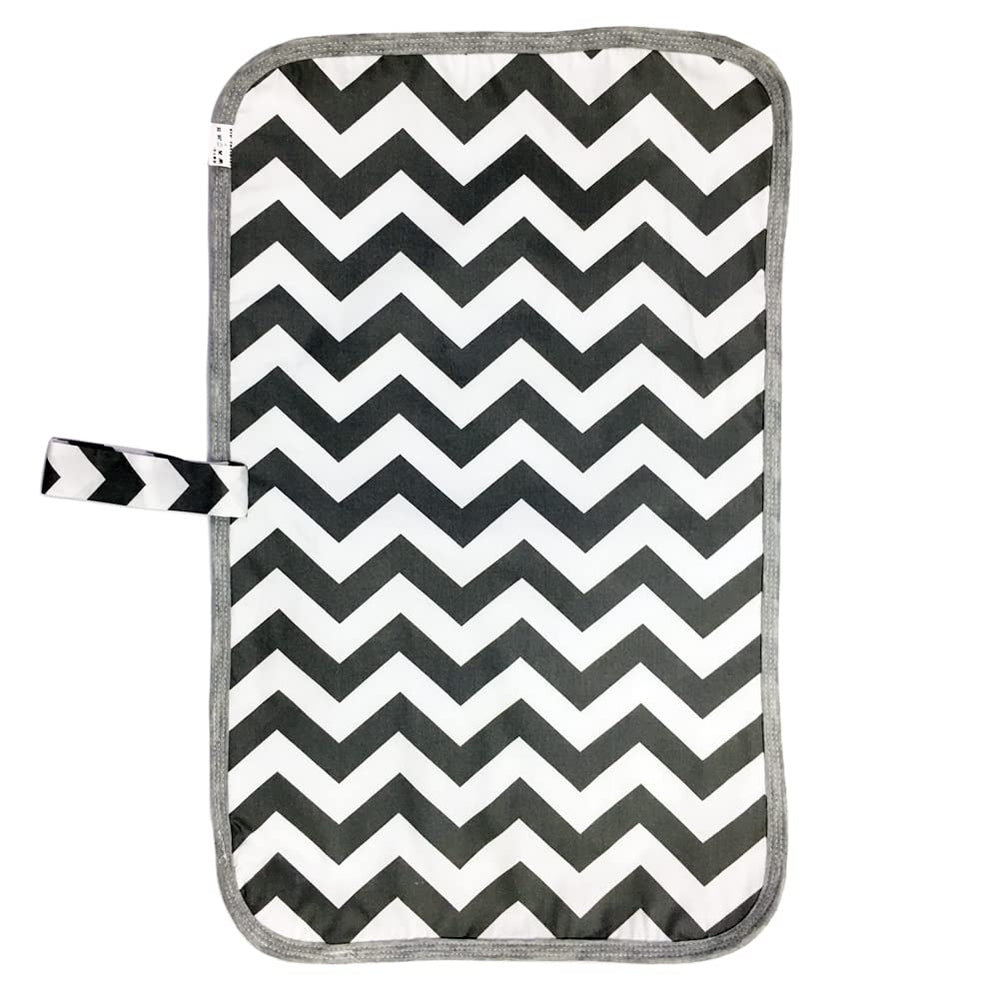 Medsuo changing mat laid flat with roomy baby area for comfortable diapering.