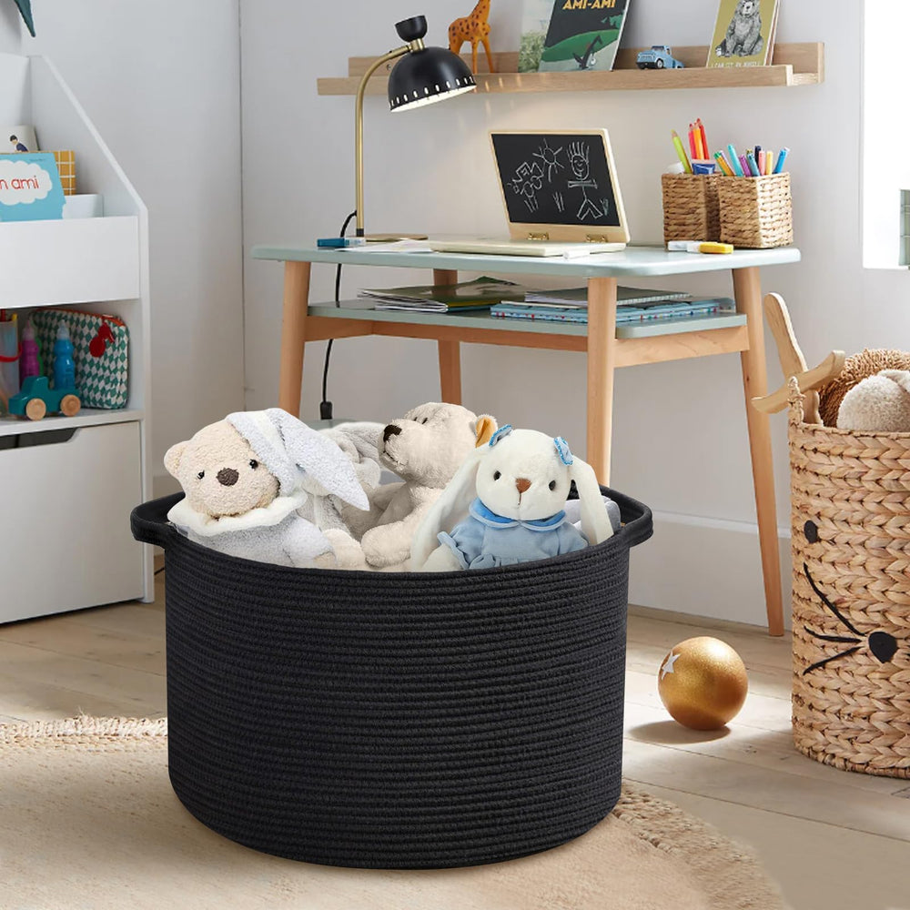 MEGASKET blanket basket used as a laundry hamper for light clothes storage.