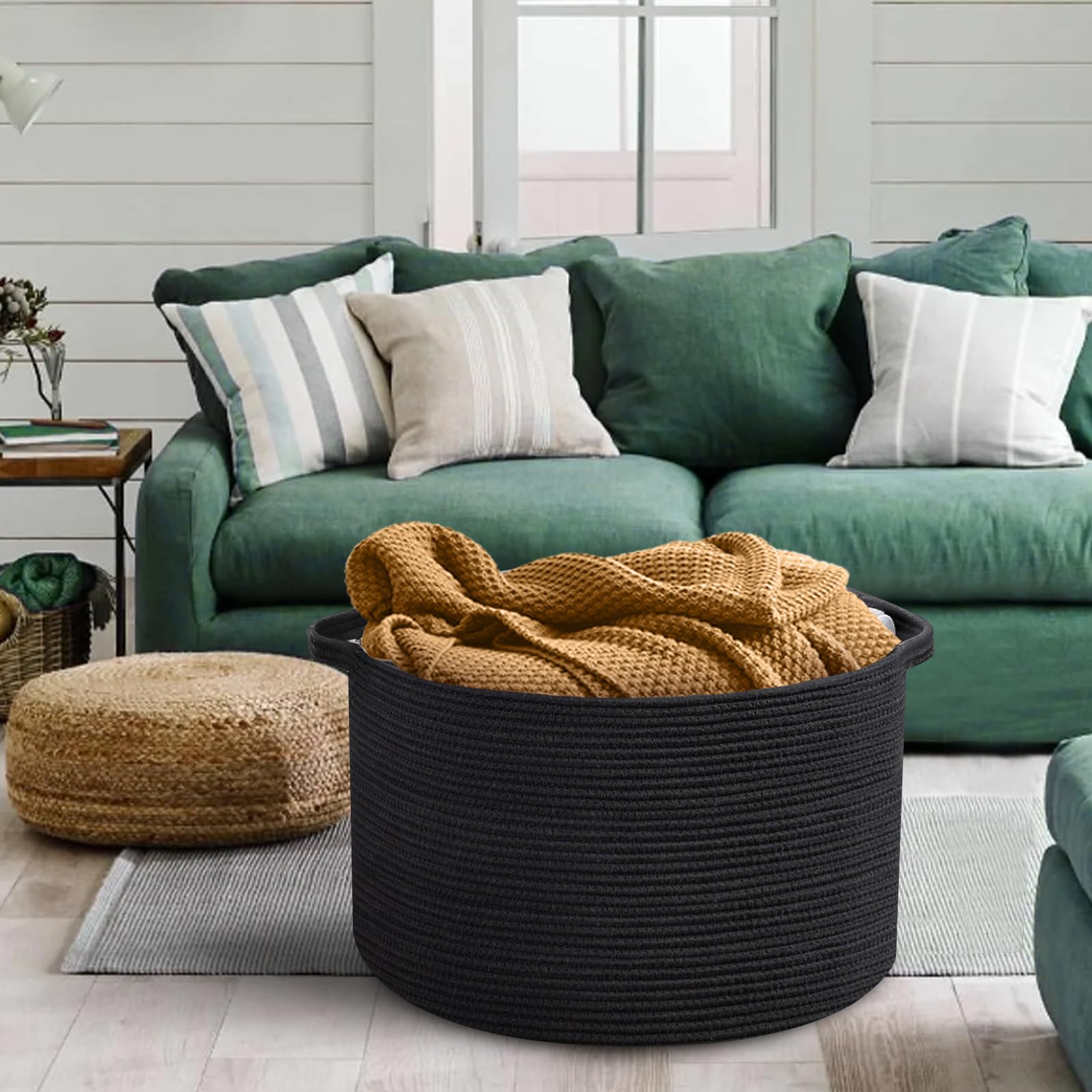 MEGASKET blanket basket with decorative pillows complements bedroom decor.