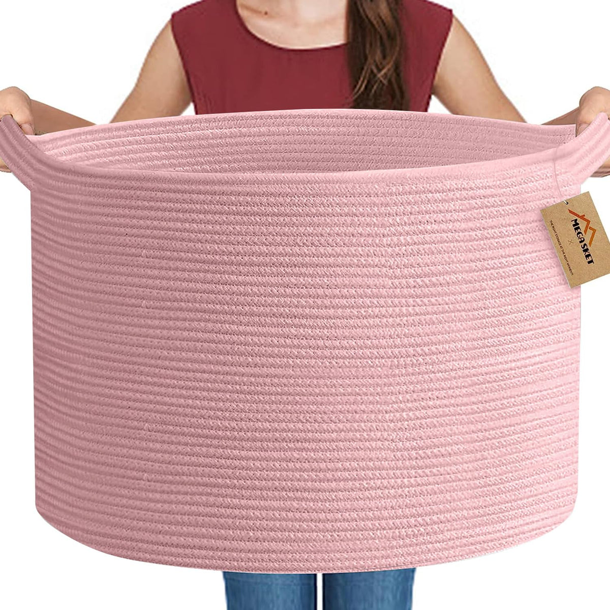 MEGASKET Extra Large Pink Basket front view shows ample blanket storage in a cozy living room.