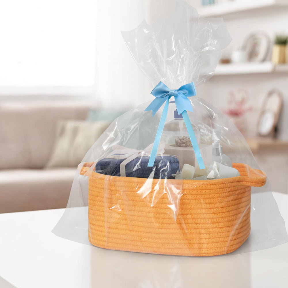 MEGASKET orange woven basket in nursery setup for diapers and toys.