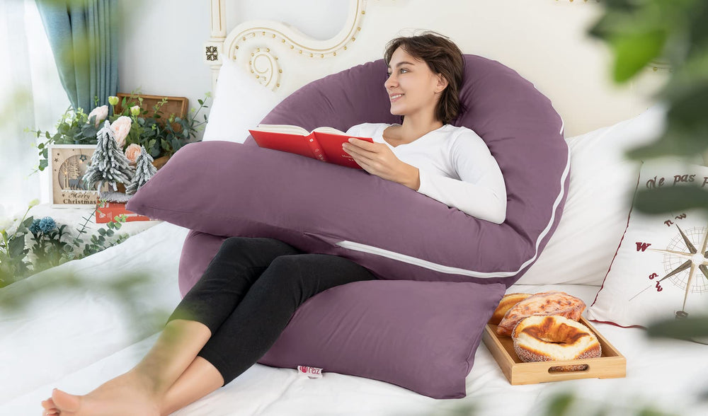 Meiz pillow supports side-lying comfort and belly relief.