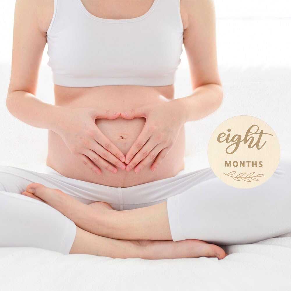 Meliatomia milestone discs used as photo props during newborn sessions.