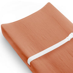 Meowcards changing pad cover in brick front view showing soft, breathable muslin for baby comfort