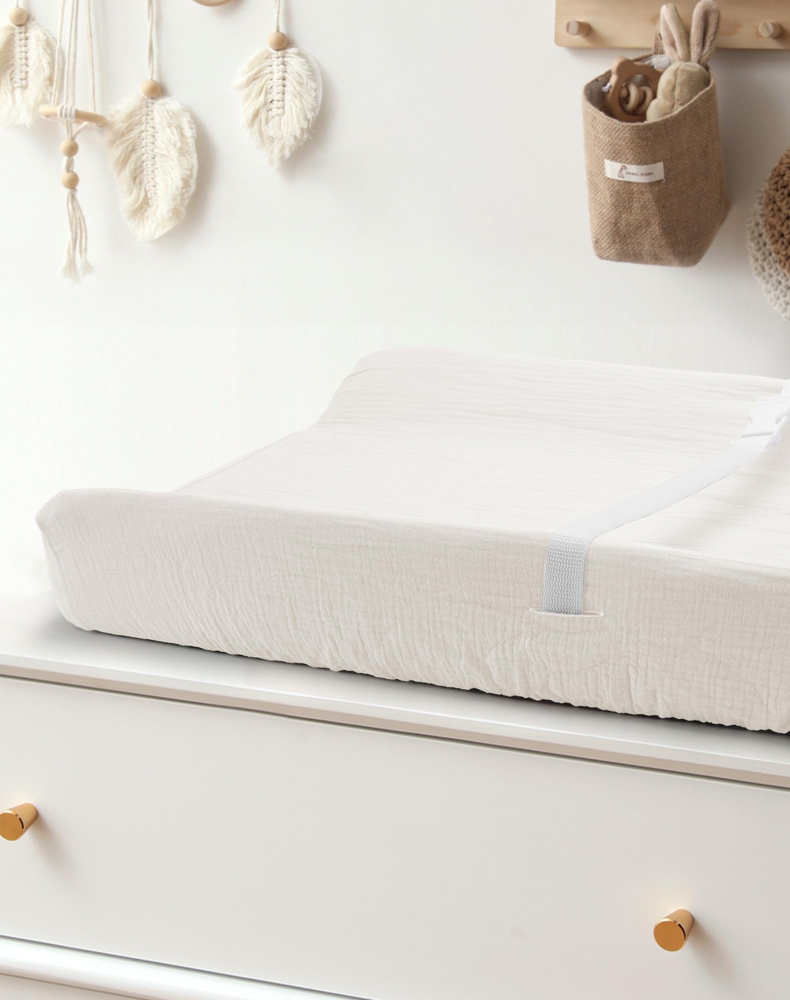 Meowcards changing pad cover with safety belt holes and elastic for secure fit.