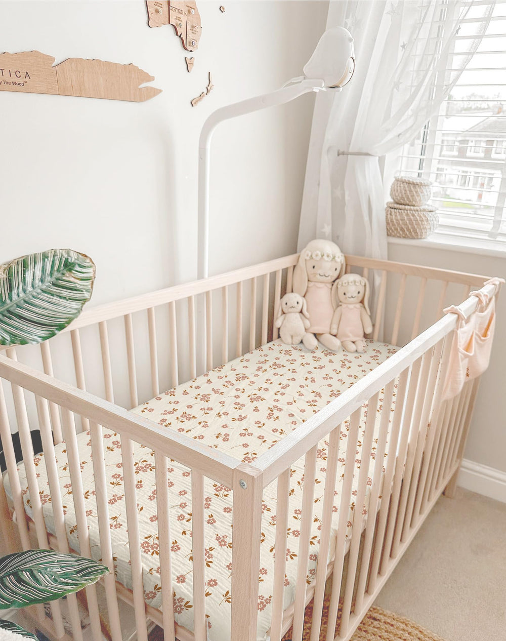 Meowcards mini crib sheets drape and snug display creates a cozy nursery vibe.