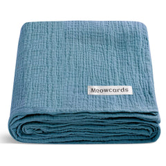 Meowcards muslin swaddle blanket blue flatlay showcases soft fabric for newborn snuggles.