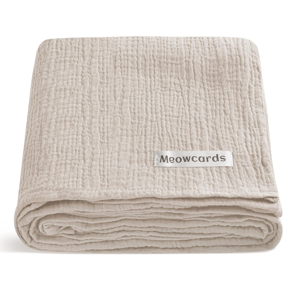 Meowcards Muslin Swaddle Blanket close-up shows ultra-soft double muslin texture for newborn comfort.