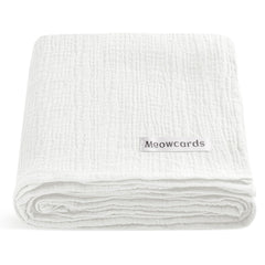 Meowcards muslin swaddle blanket white flat lay highlights breathable, ultra-soft fabric