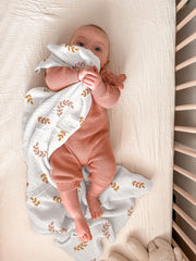 Meowcards swaddle blanket leaf closeup shows soft, double-muslin texture.