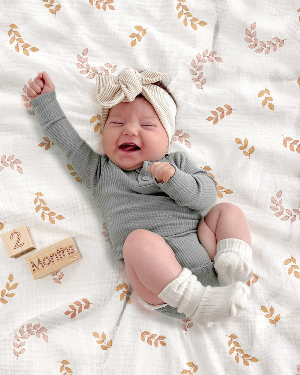 Meowcards swaddle blanket leaf durable muslin for long-lasting use.