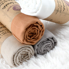 Meracorallo camel muslin blanket used as receiving blanket for newborn moments