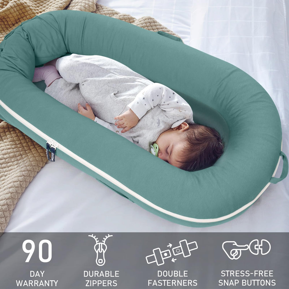 MEXXI organic replacement cover DockATot Sage Green tag highlights non-toxic dyes and skin-friendly use