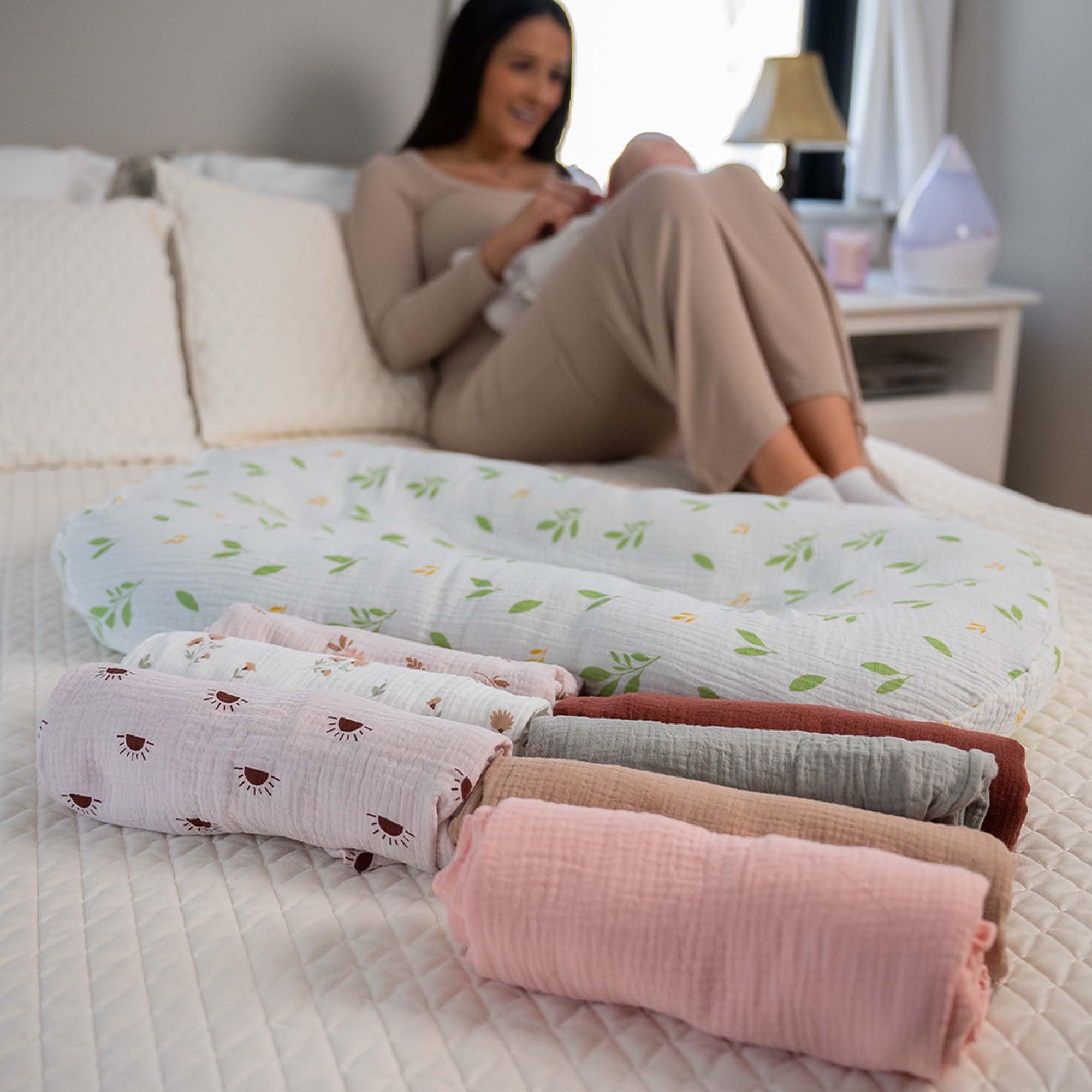 Mi Flor Muslin Baby Lounger Cover shown in use for calm, content babies.