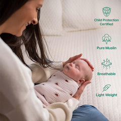 MiFlor muslin swaddle on baby demonstrates secure, womb-like swaddle for calm sleep.