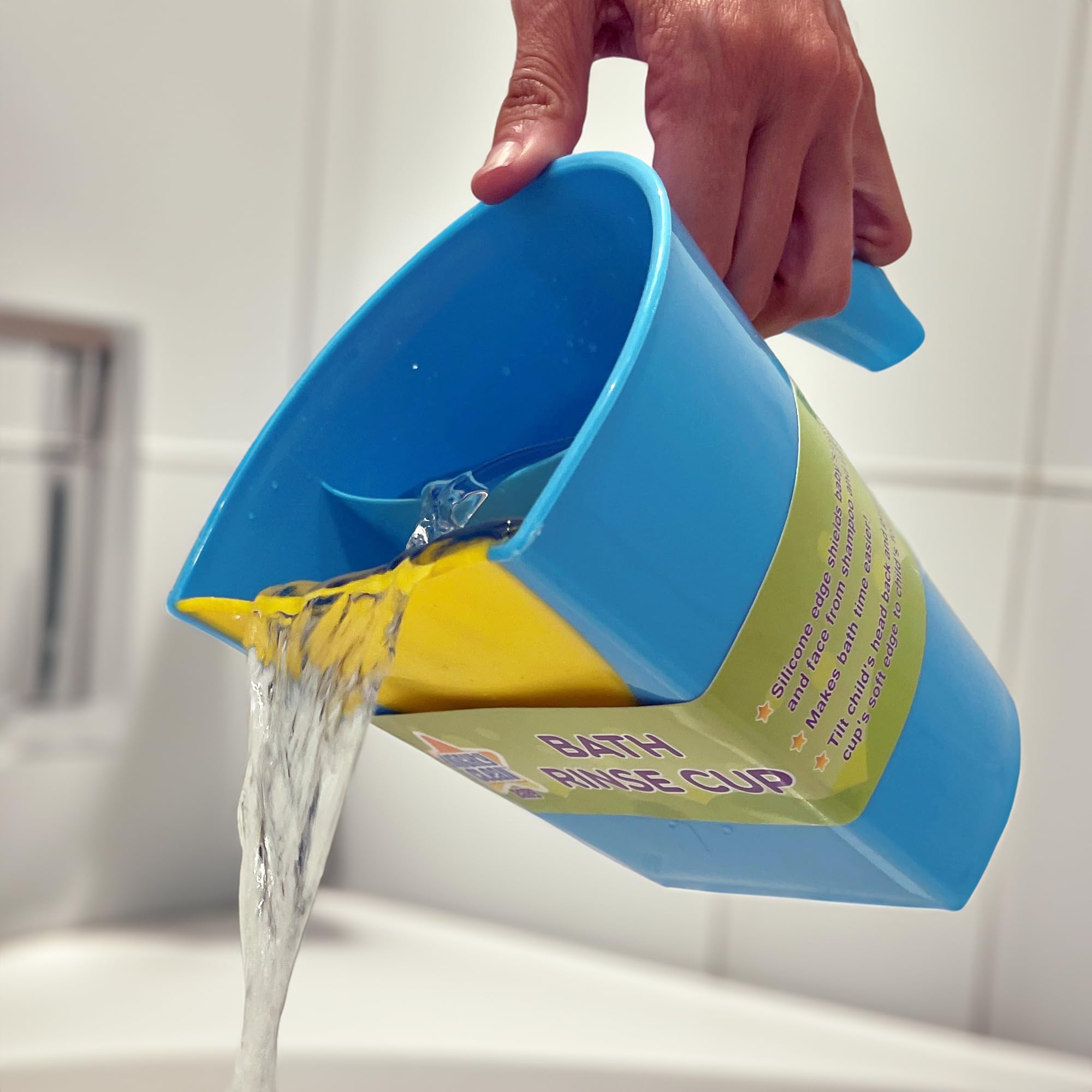 Mighty Clean Baby rinse cup in tub with bath toys for playful rinsing.