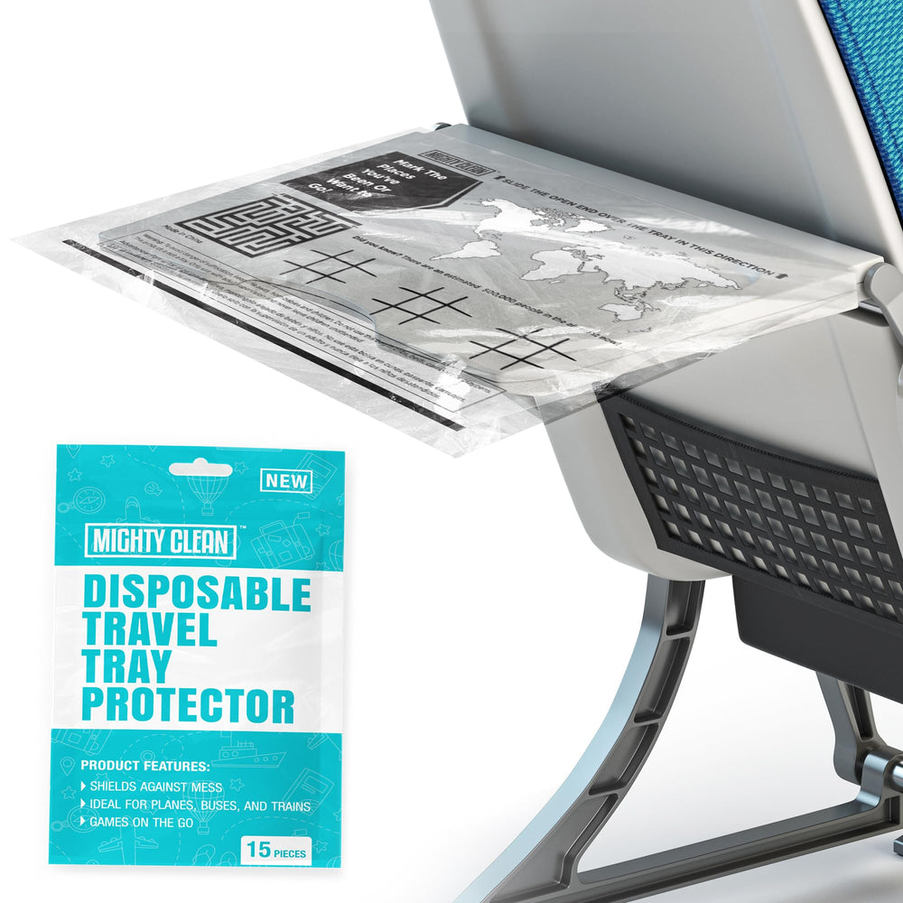Mighty Clean disposable travel tray protector on an airplane tray, keeping surfaces clean for snacks.