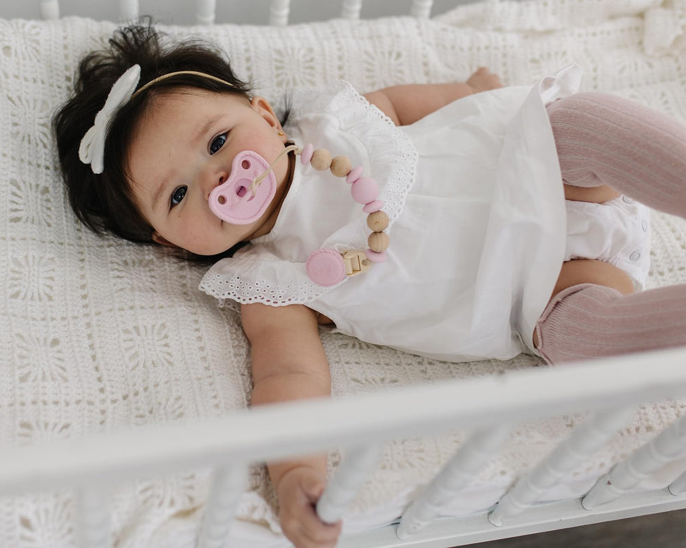 Mila & Lulu seamless design pacifier reduces crevices for easier cleaning and hygiene.