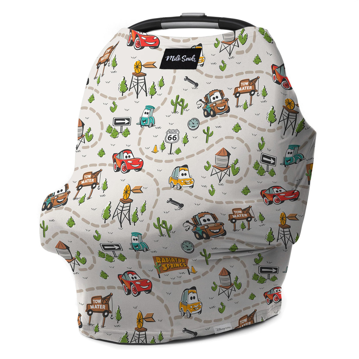 Milk Snob Disney Cars 5-in-1 car seat cover shielding baby on the go