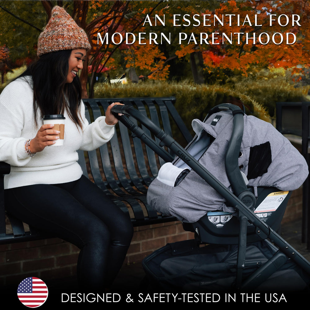 Milk Snob cover features a brim to shield from rain while baby stays visible