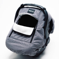 Milk Snob Winter Car Seat Cover showing waterproof outer shell protecting baby from wind and rain on outings