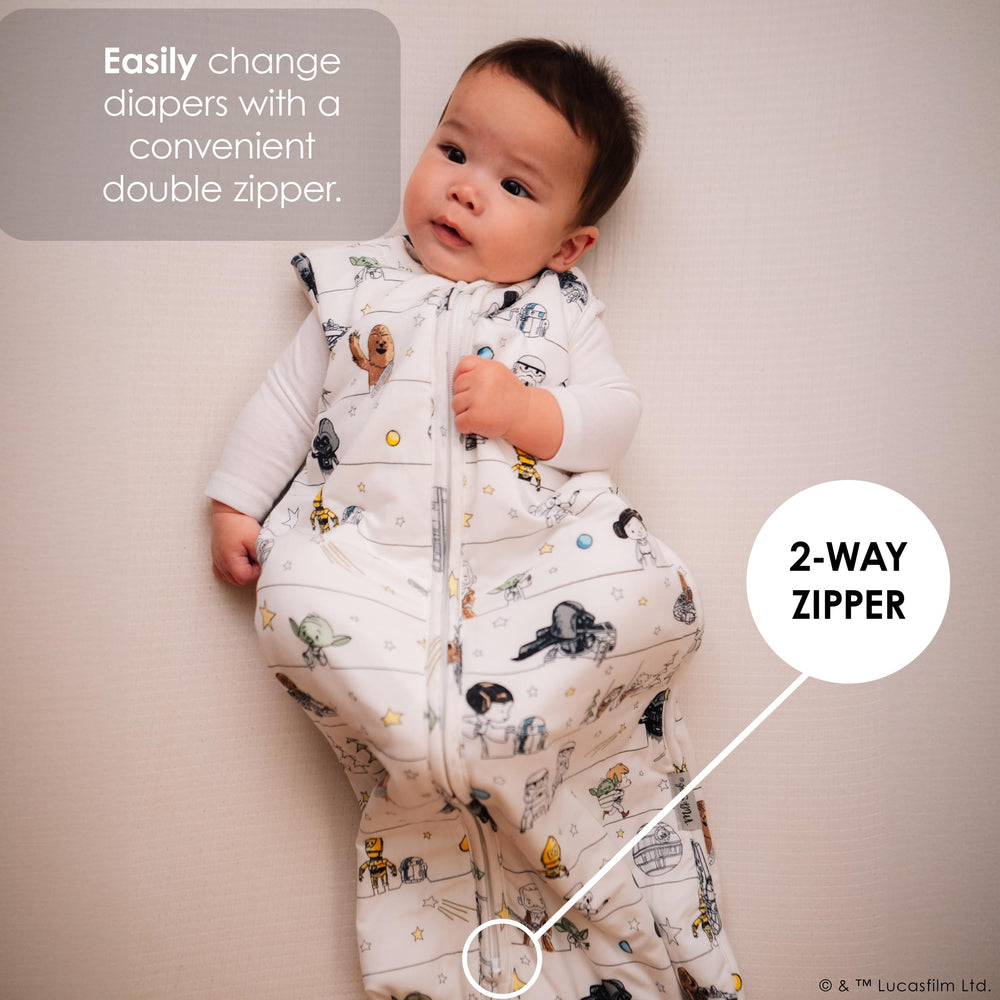 Milk Snob wearable blanket on baby illustrates cozy, safe crib-side use.